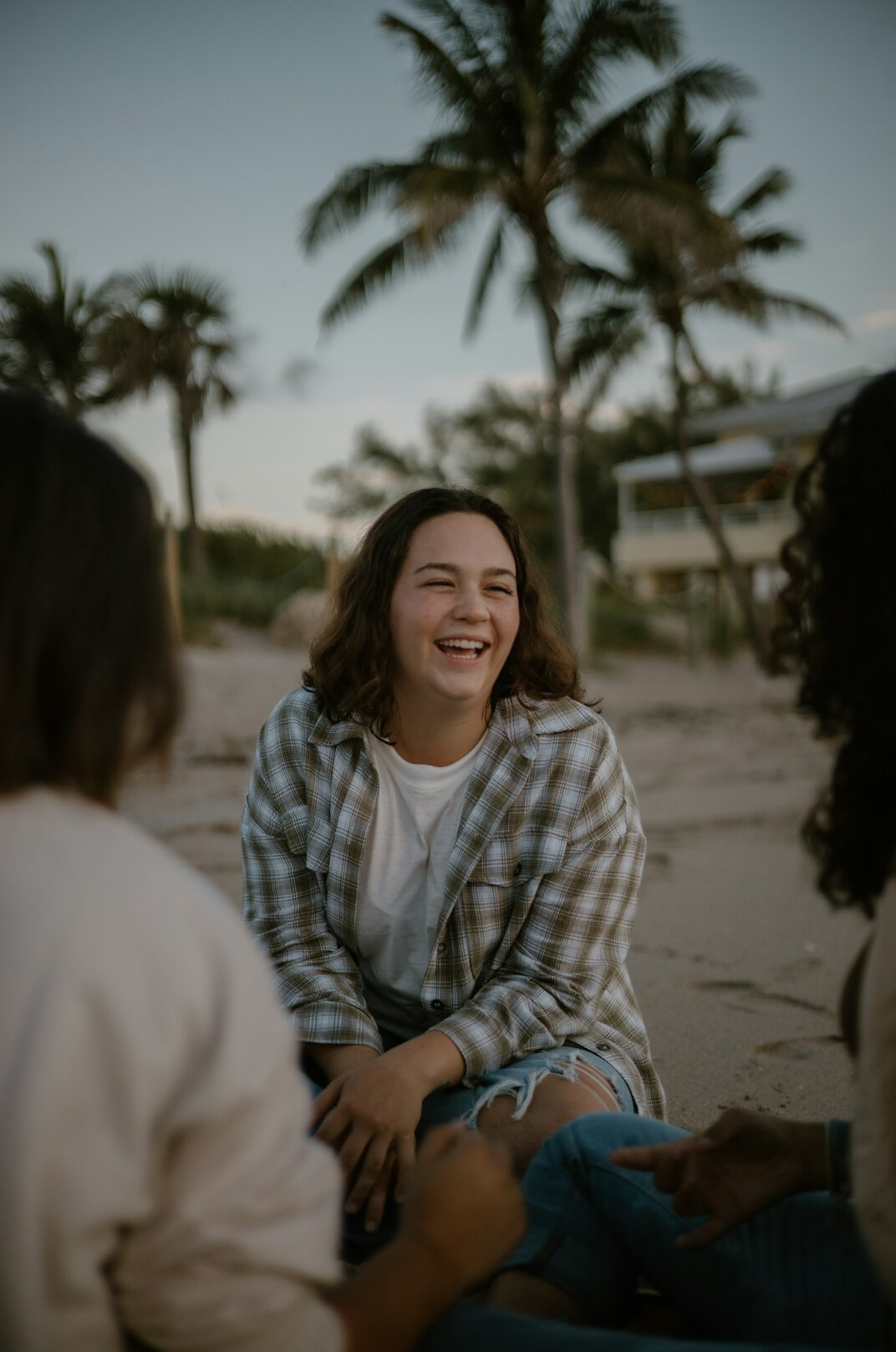 Small diverse group of Brazilian people sitting together talking and smiling