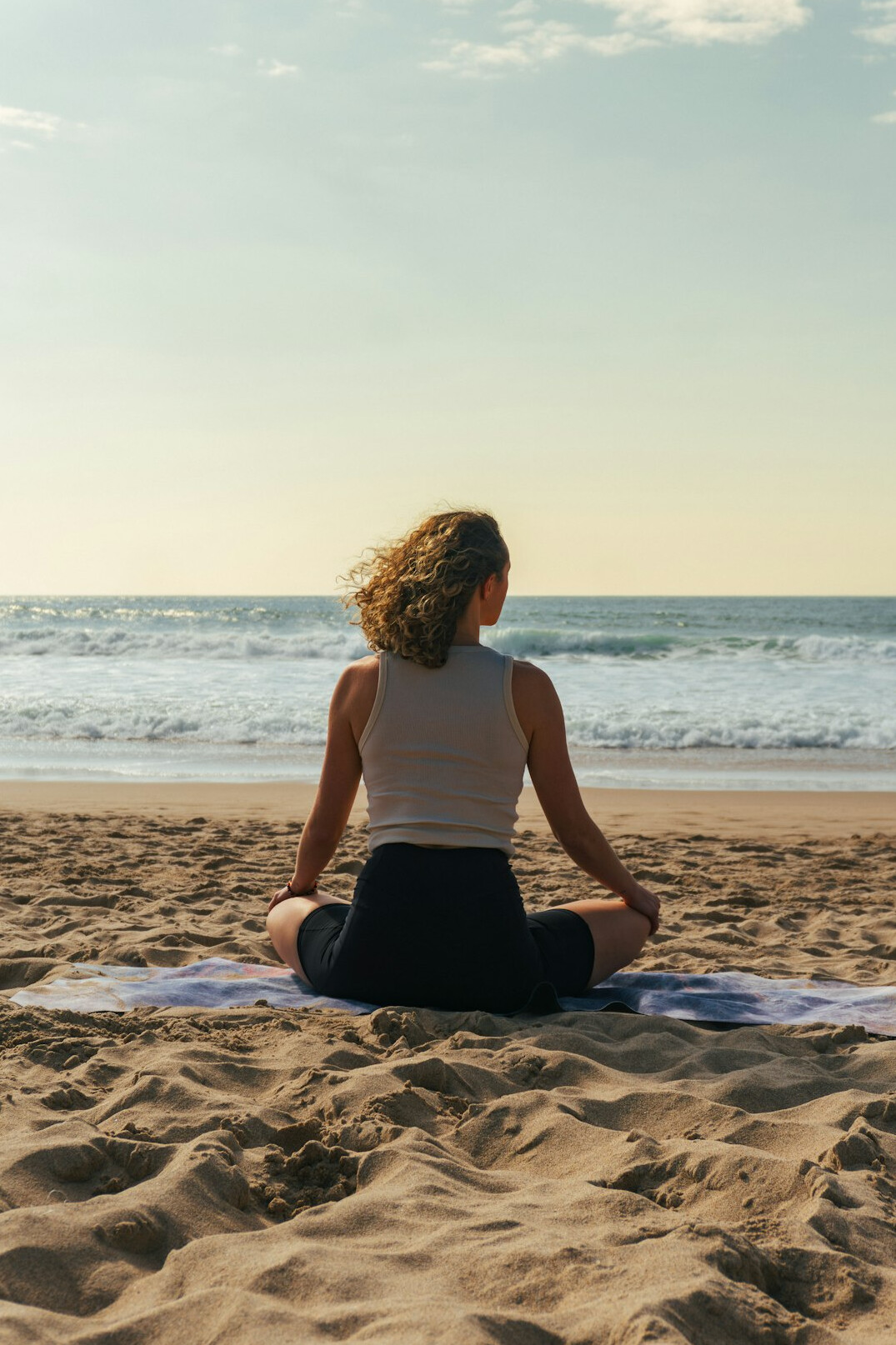 person meditating outdoors